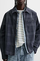 VESTE À CARREAUX ZIPPÉE