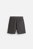 IRREGULAR TEXTURED BERMUDA SHORTS