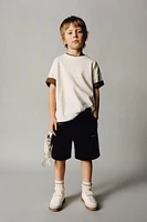 STRAIGHT FIT EMBOSSED TEXT TERRY SHORTS