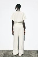 CREPE LONG JUMPSUIT WITH WAIST BUCKLE
