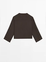 Flowing shirt with button detail on the chest