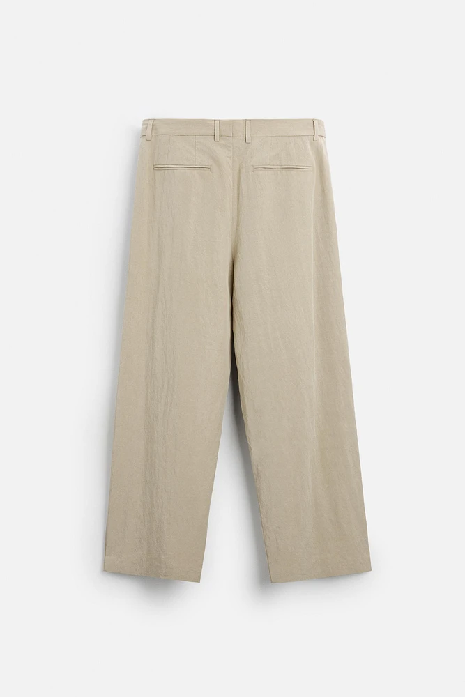 PANTALON COUPE LARGE À PLIS