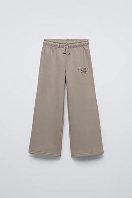 PLUSH WIDE LEG TEXT PANTS