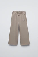 PLUSH WIDE LEG TEXT PANTS
