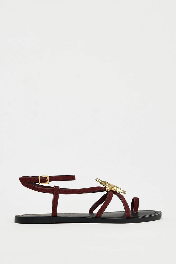 FLAT SUEDE SANDALS WITH METALLIC PIECE