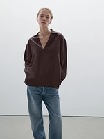 Flowing shirt featuring long sleeves with vents