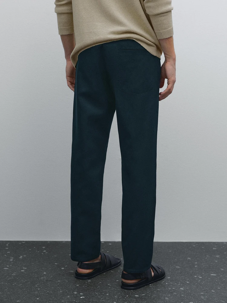 Faux jean tapered fit en coton mélangé