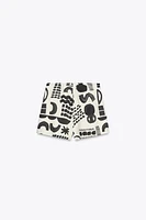 PRINTED BUCKLE MINI SKIRT