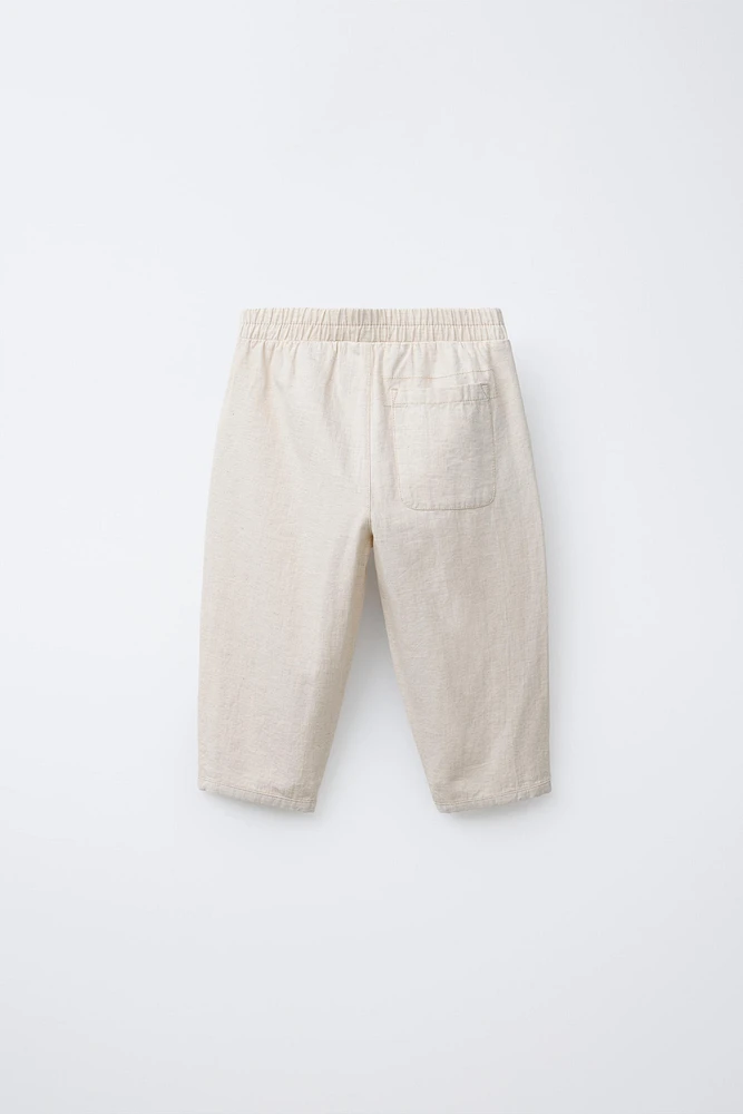 PANTALON BAGGY À BOUTONS EN LIN