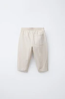 PANTALON BAGGY À BOUTONS EN LIN