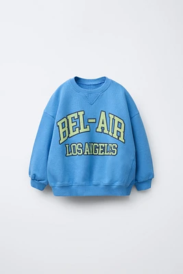 RAISED TEXT SWEATSHIRT