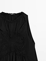 Flowing halter top with gathered detail