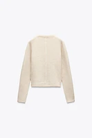 KNIT SWEATER WITH CONTRASTING PIPING