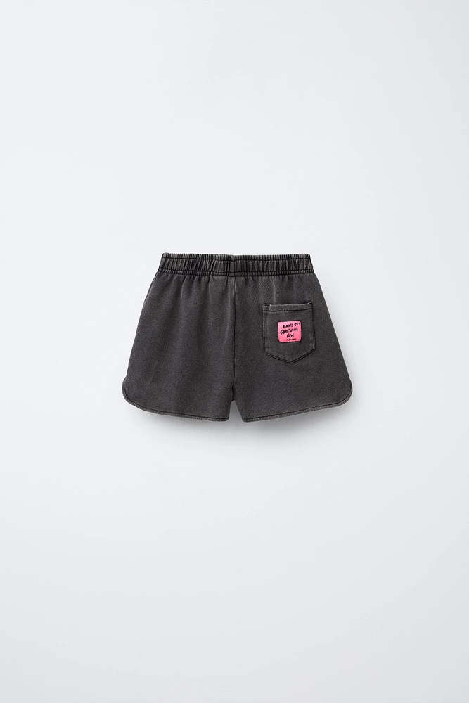 SMILEYWORLD ® WASHED EFFECT PLUSH SHORTS