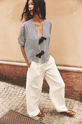 PLEATED WIDE LEG PANTS