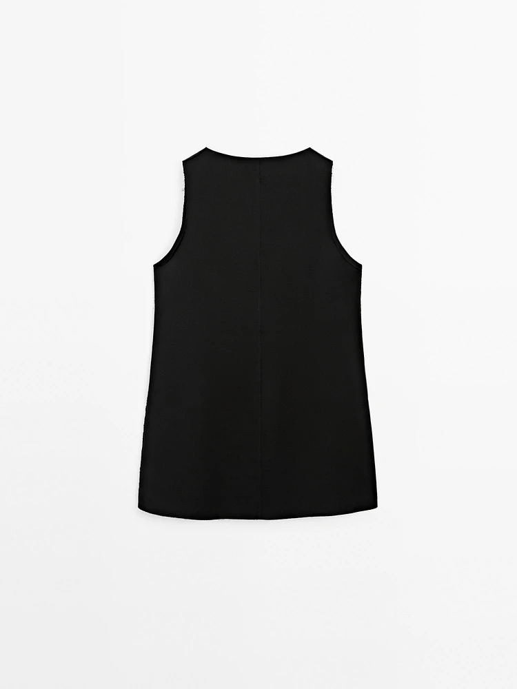 Long sleeveless satin blouse