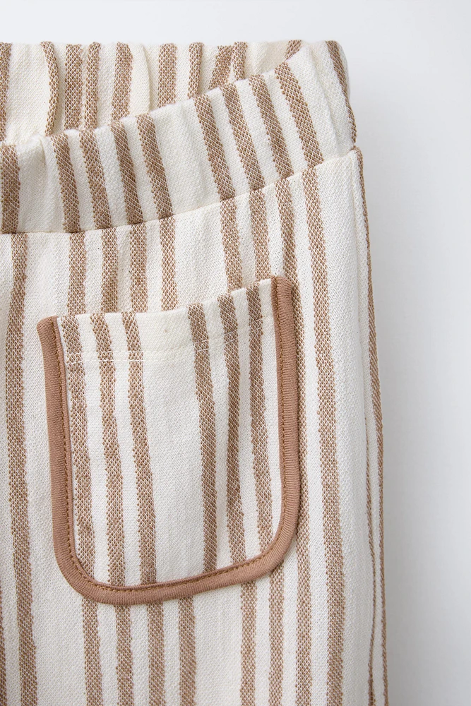 STRIPED PANTS WITH PIPED POCKETS