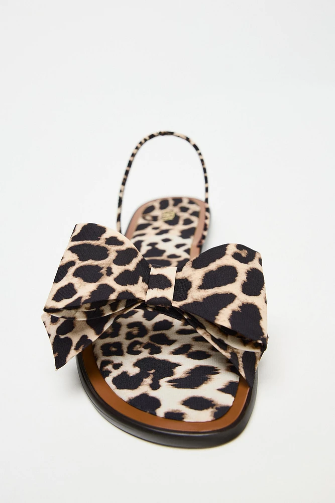 ANIMAL PRINT BOW FLAT SANDALS