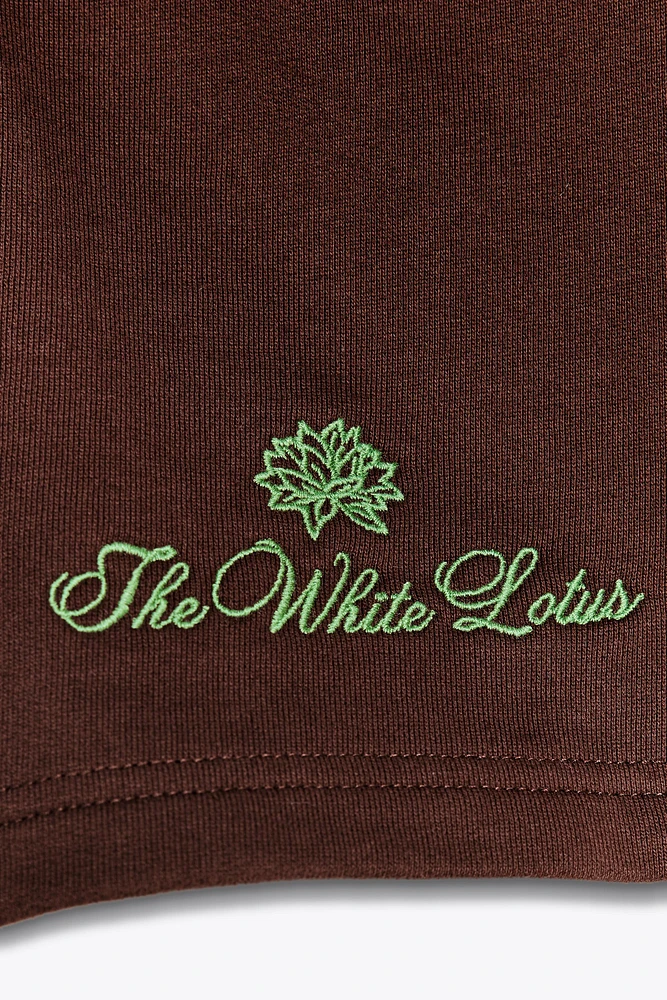 THE WHITE LOTUS FLEECE SHORTS