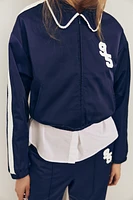 VESTE SATINÉE BANDE LATÉRALE
