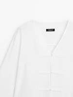 Flowing linen blend blouse with V-neckline