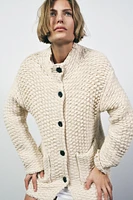 MANTEAU EN MAILLE À COL MONTANT