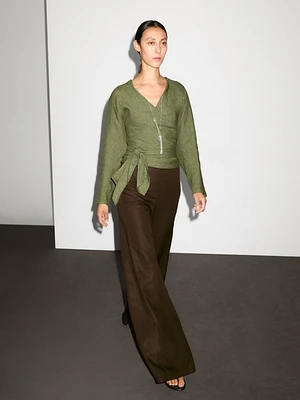 Flowing linen blouse with tie detail at the waist