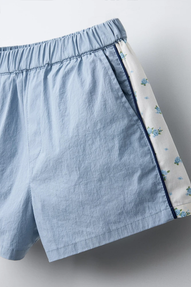 COMBINATION FLORAL TECHNICAL SHORTS