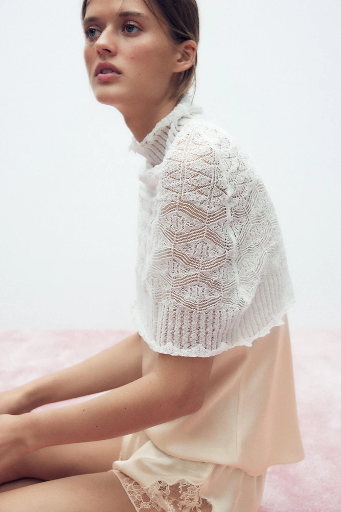 CAPE EN MAILLE TRICOT