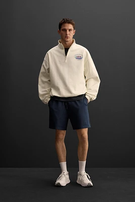 RUNNING PRINT QUARTER-ZIP SWEATSHIRT