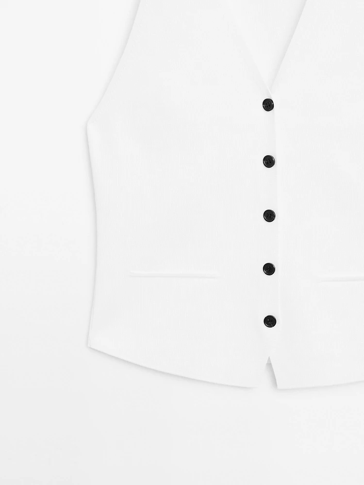 Veste sans manches en maille boutons contrastants