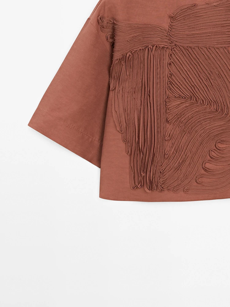 Flowing top with embroidered detail
