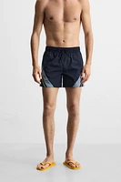 CONTRAST BANDS MID-LENGTH SWIMSUIT