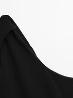 Textured swimsuit with asymmetric neckline
