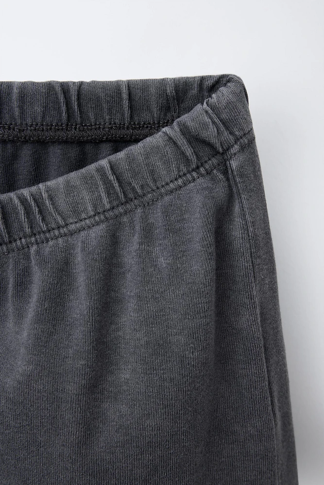 WASHED EFFECT STUDDED BERMUDA SHORTS