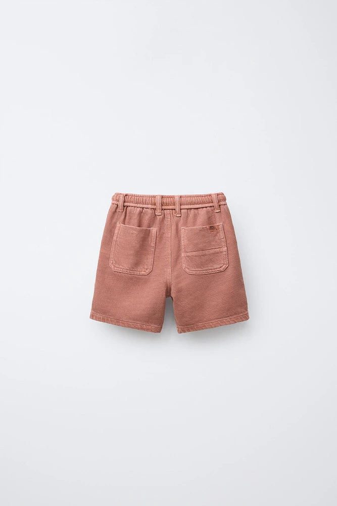 BERMUDA STANDARD TOUCHER DOUX