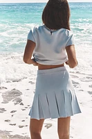 BOX PLEAT KNIT MINI SKIRT