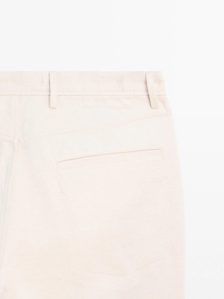 Cotton blend tapered fit denim trousers