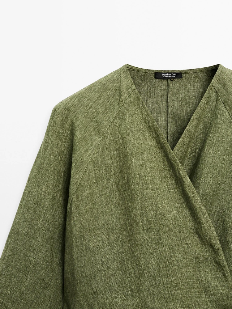 Flowing linen blouse with tie detail at the waist