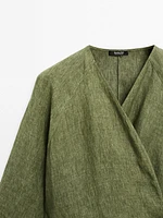 Flowing linen blouse with tie detail at the waist
