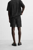 SHORT EN JACQUARD GÉOMÉTRIQUE