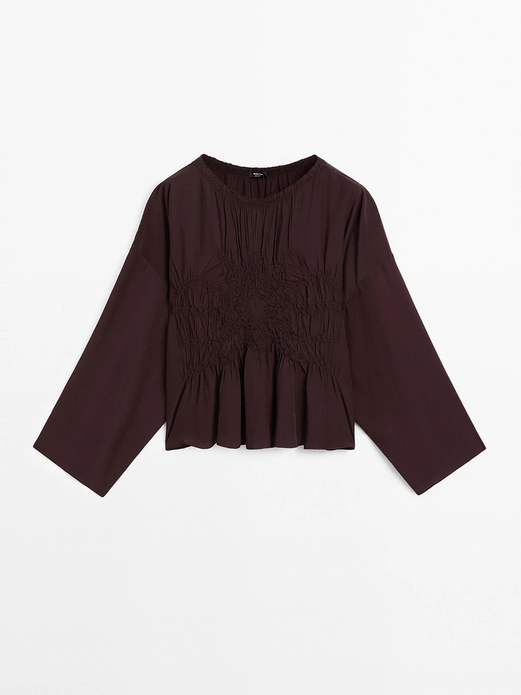 Flowing blouse with gathered detail