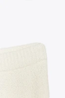 MINI JUPE EN MAILLE À SURPIQÛRES