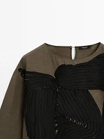 Flowing blouse with contrasting ribbons
