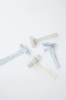 PACK OF FOUR BOW HAIR CLIPS WITH FLOWER