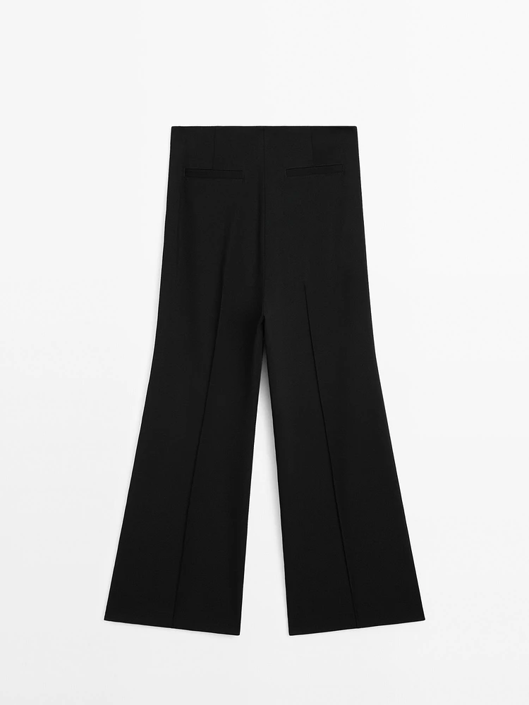 Flared trousers with zip
