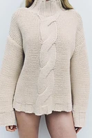 PULL EN MAILLE À TORSADES