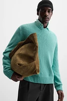 Relaxed fit cotton blend sweater. Round neck and long sleeves. Rib trim.