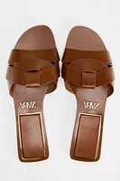 FLAT CROSSED LEATHER SANDALS