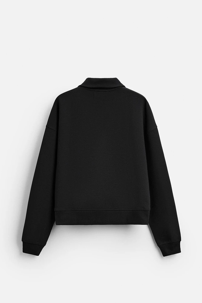 TECHNICAL QUARTER-ZIP SWEATSHIRT